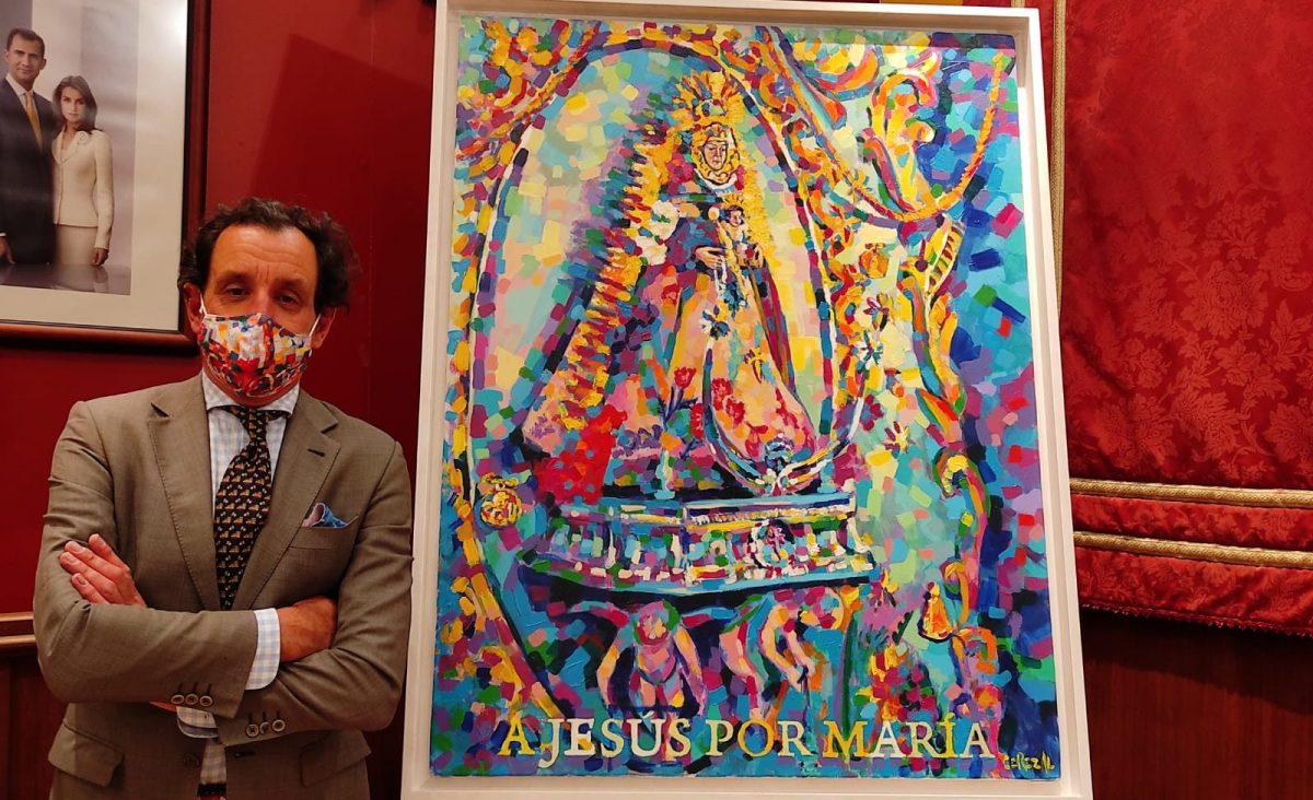 José Cerezal junto al cartel de la hermandad del Rocío de Villanueva para 2021.