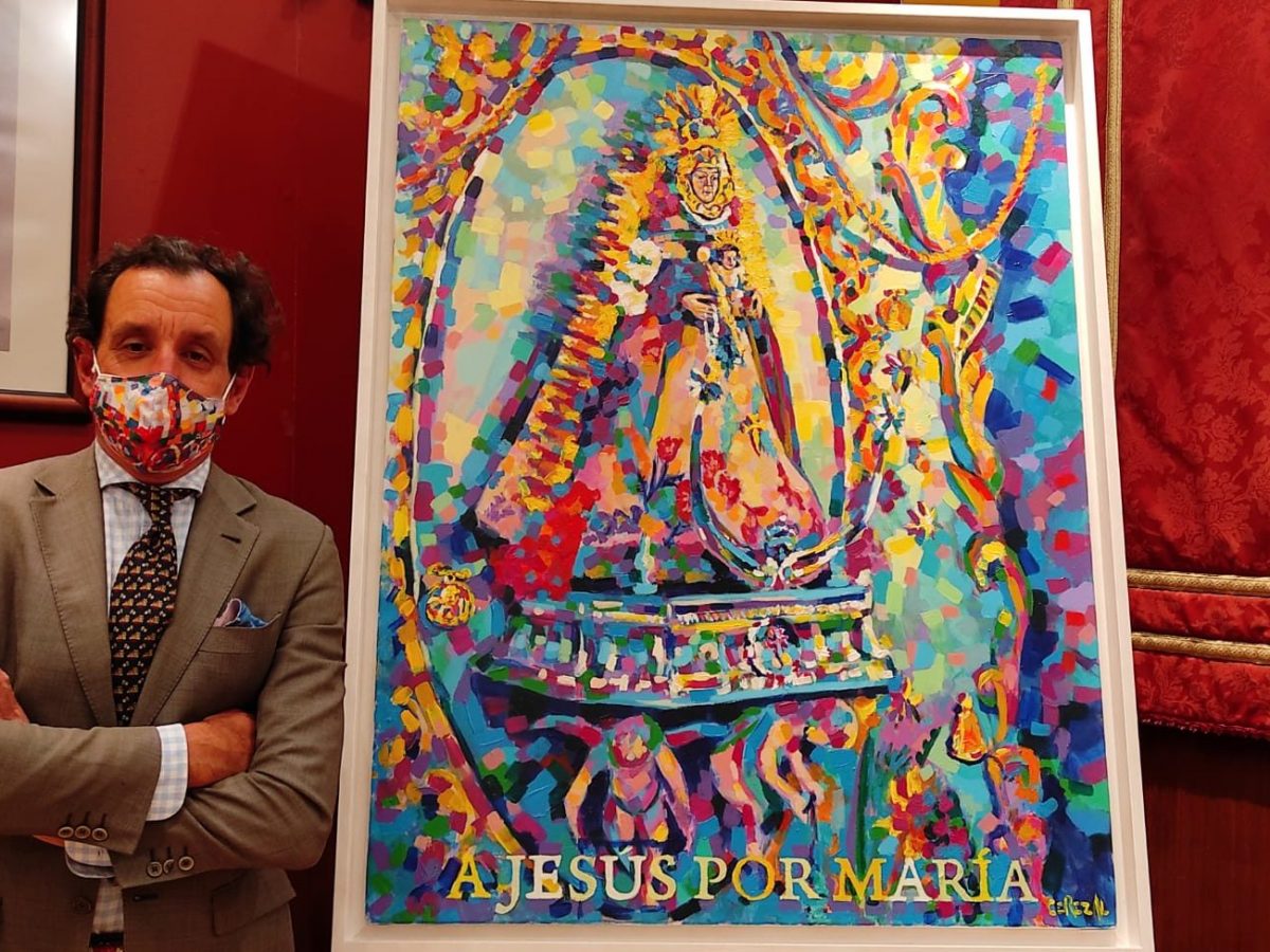 José Cerezal junto al cartel de la hermandad del Rocío de Villanueva para 2021.